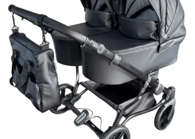 poussette jumeaux cote a cote pour 2 enfants en similicuir couleur noir, roues increvables, chassis double noir,