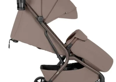 Side view of a taupe/brown baby stroller with an adjustable canopy, posable seat, and a storage basket underneath; four wheels and a cup holder visible on the handle.