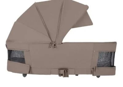 Beige baby stroller bassinet attachment with canopy and mesh side pockets on a wheeled base (for newborns).